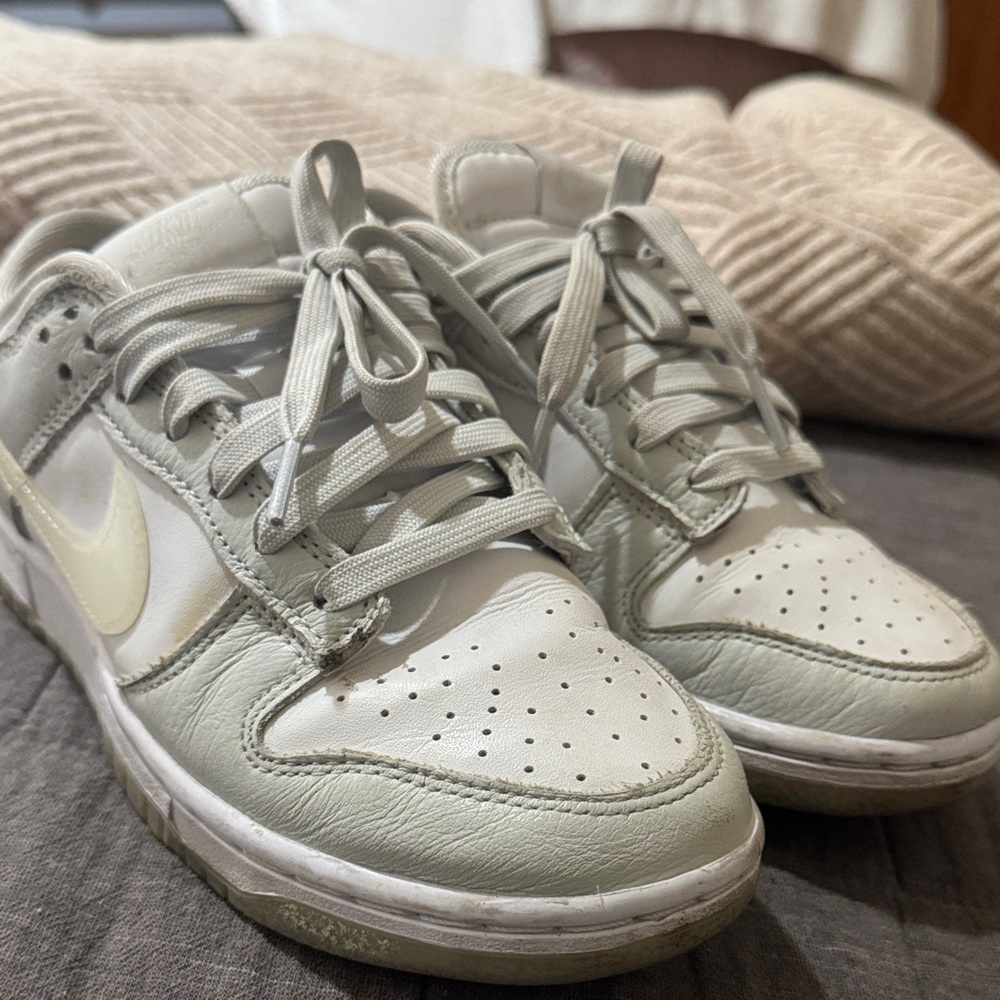 Nike Low-Top Sneakers in Light Gray with Pale Yellow Swoosh